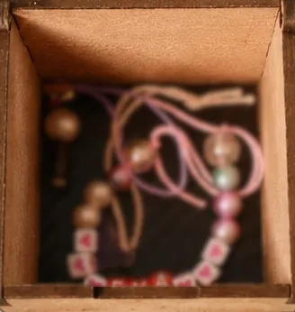 Example contents inside 70 × 70 × 70 mm Fan Vault, blurred for privacy